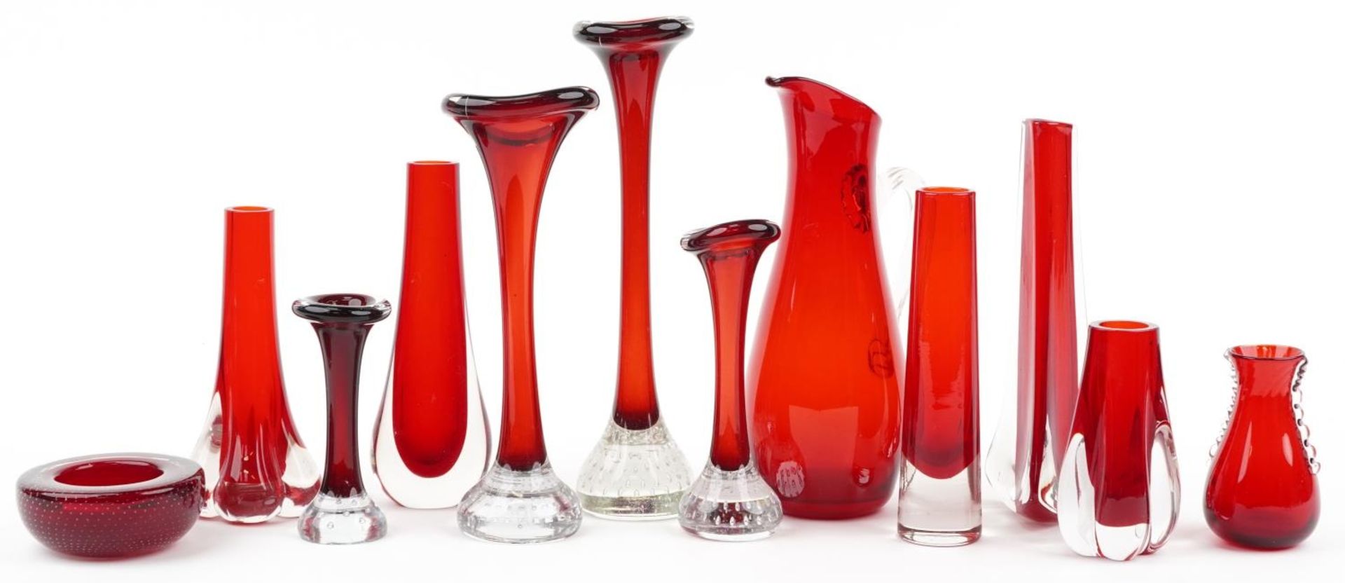 Whitefriars ruby glassware including sparrow beak pitcher and vases with controlled bubbles, the