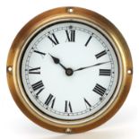 Brass ship's clock with enamelled dial having Roman numerals, 18cm in diameter : For further