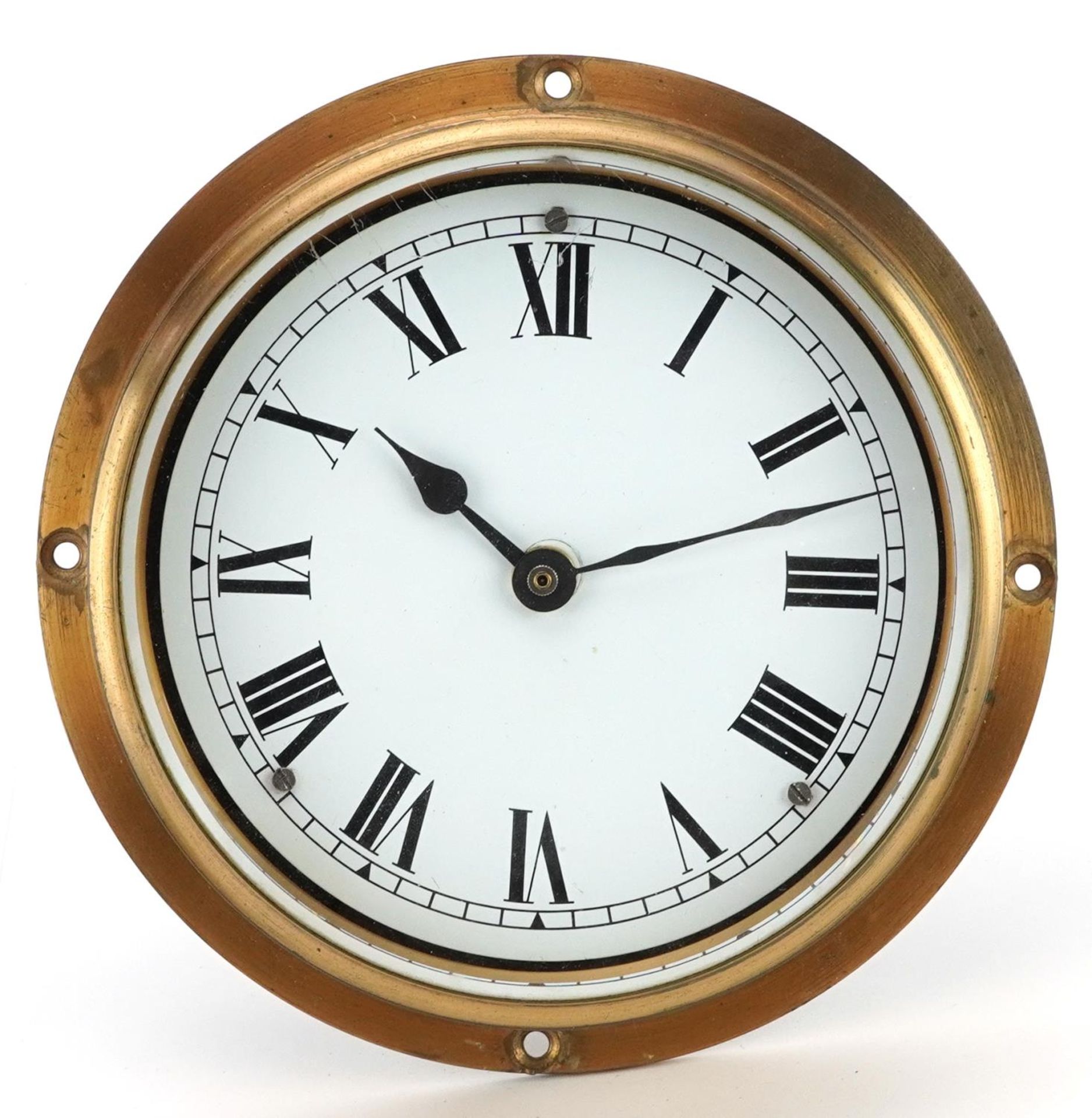 Brass ship's clock with enamelled dial having Roman numerals, 18cm in diameter : For further