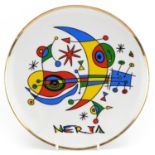 Saffron porcelain plate decorated with an abstract composition, signed Nerja, 19.5cm in diameter :