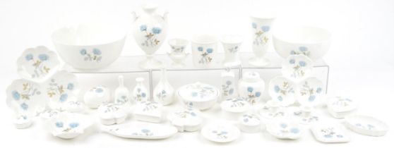 Collection of Wedgwood Ice Rose china including fruit bowl, vases and trinket boxes, the largest