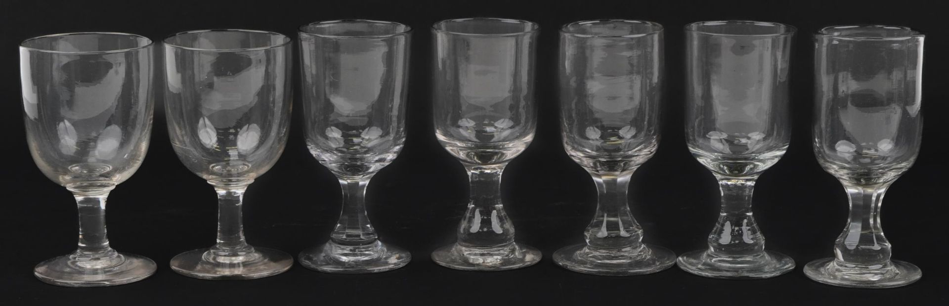 Seven Georgian glass rummers including three pairs, the largest each 15.5cm high : For further