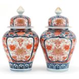 Pair of Japanese Imari porcelain vases and covers hand painted with flowers, each 28cm high : For