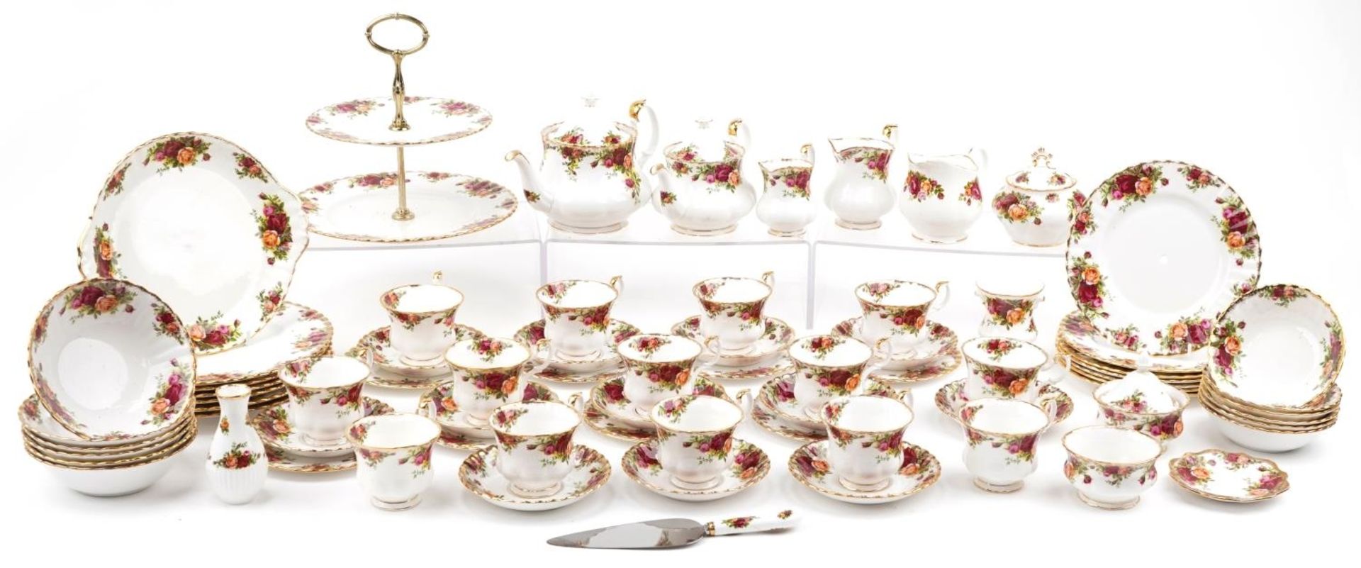 Royal Albert Old Country Roses tea and dinnerware including two teapots, trios and cake stand, the