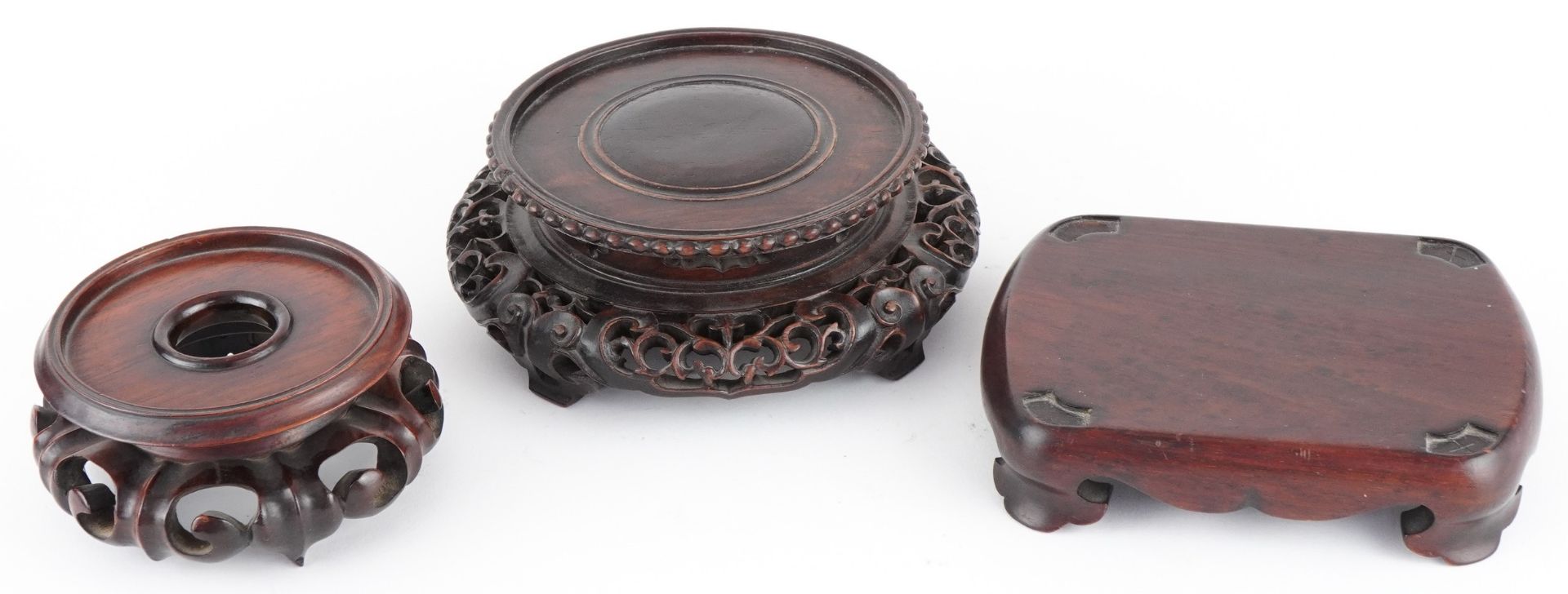 Three good Chinese hardwood stands including two circular examples, possibly Hong Mu, the largest