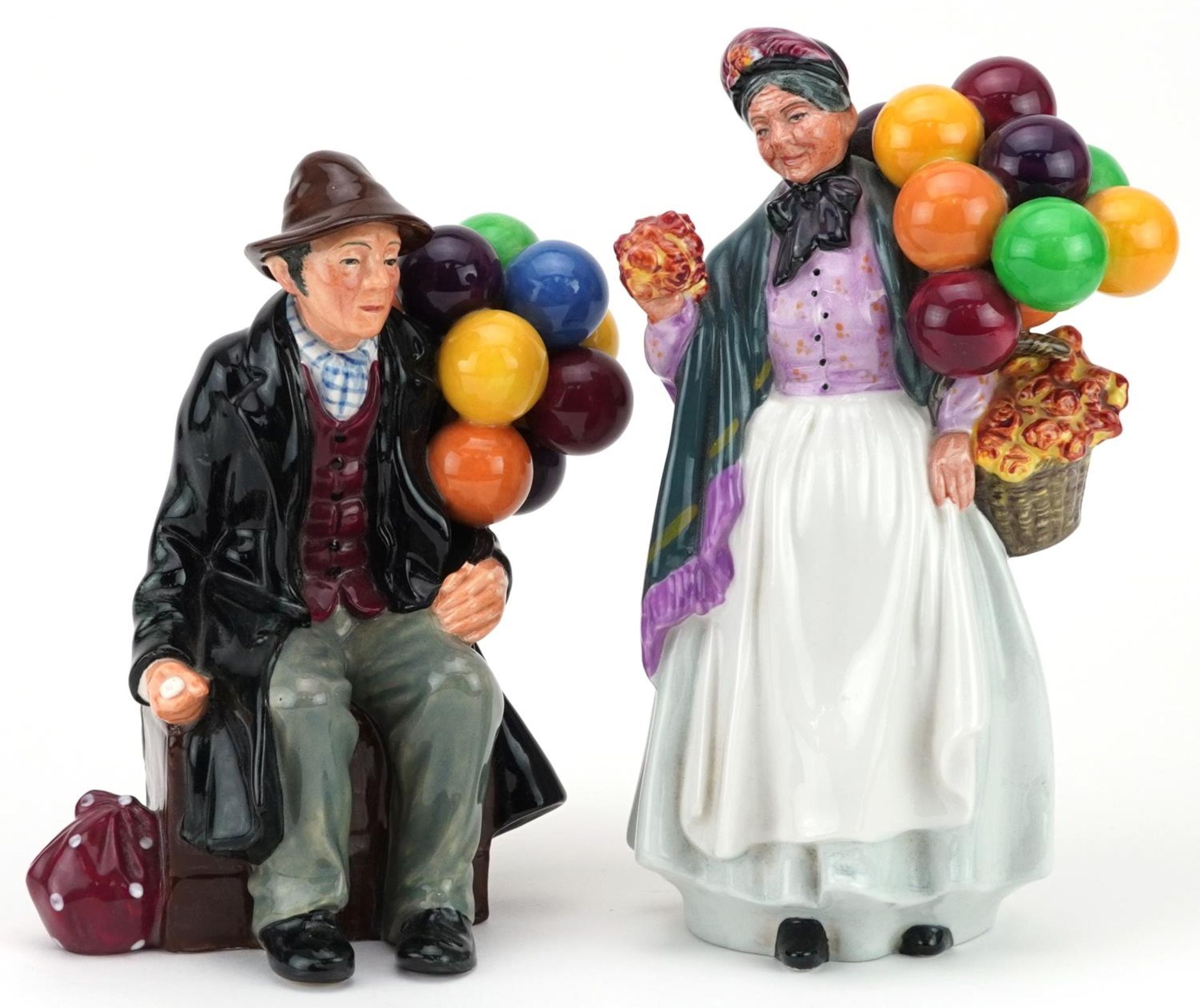 Two Royal Doulton figures comprising Biddy Penny Farthing HN1843 and The Balloon Man HN1954, 22cm