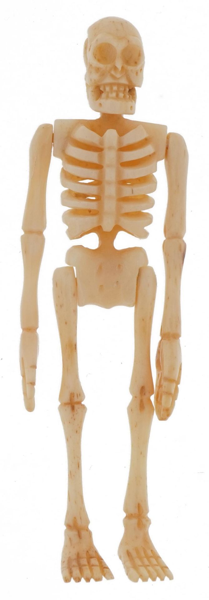 Novelty carved bone articulated skeleton housed in a sectional bone coffin, the largest 11.5cm in - Image 3 of 6