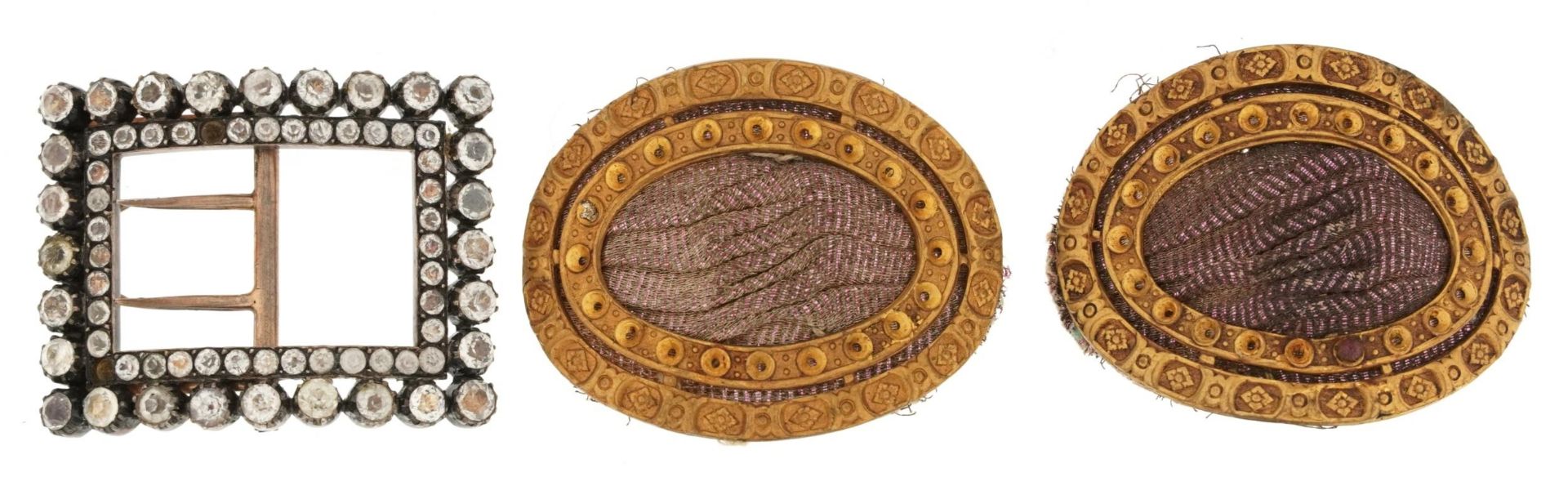 Two Georgian gilt metal shoe buckles together with a silver metal rhinestone buckle, the largest 6cm