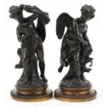 Pair of 19th century Grand Tour classical patinated bronze figures of Putti including one drawing an