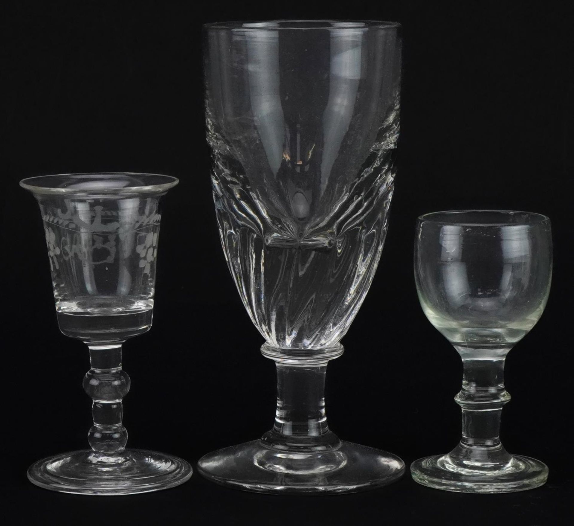 Three 18th century and later glasses including one with folded foot etched with berries, the largest - Image 2 of 3