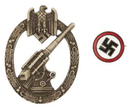 German military interest assault badge and a swastika brooch : For further information on this lot