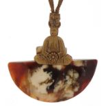 Tibetan hardstone pendant mounted with a Buddha on a gilt metal necklace, the pendant 5.5cm high :