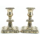 Viner's Ltd, pair of George V silver candlesticks embossed with flowers and foliage, Sheffield 1932,