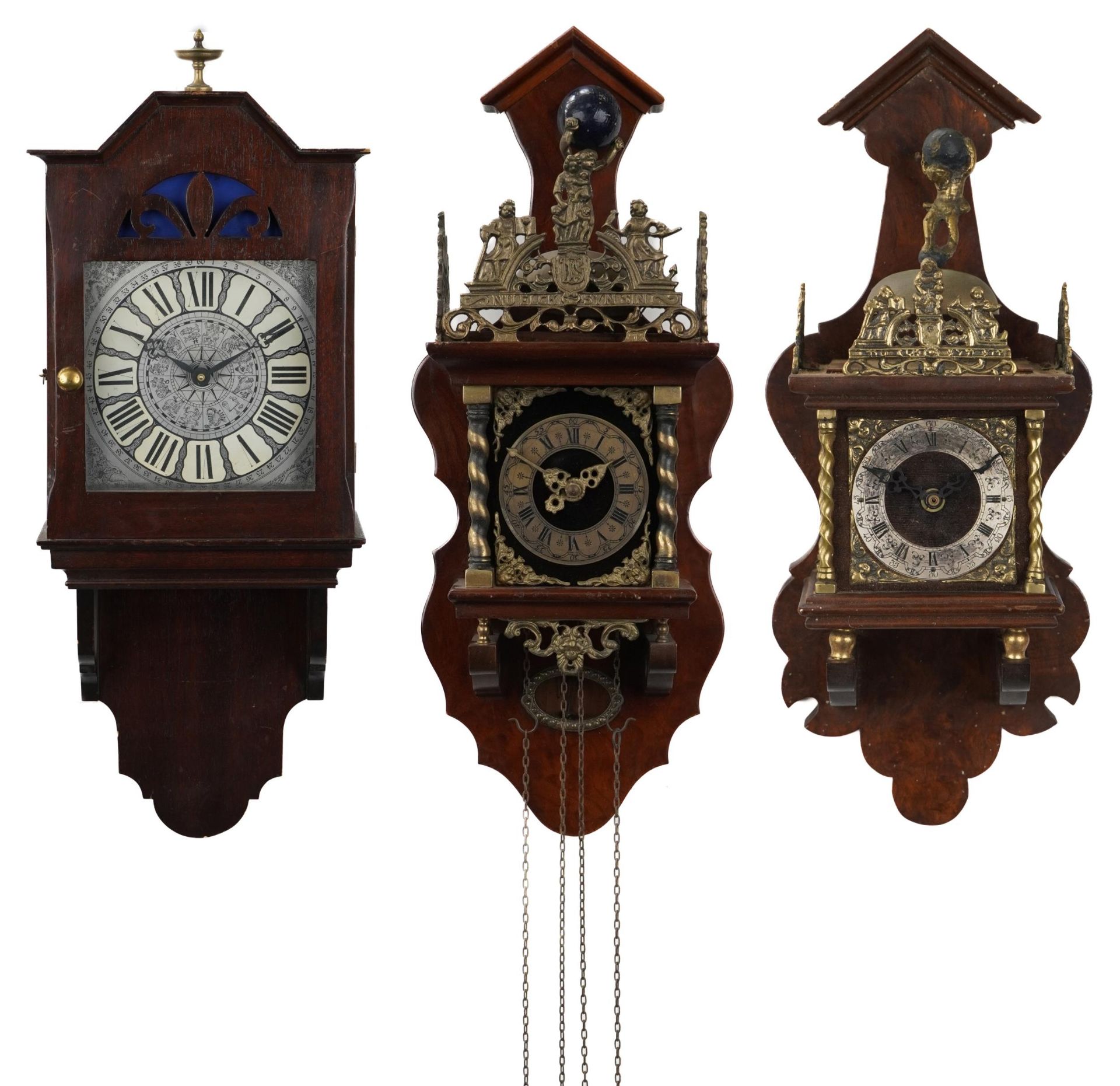 Two exotic and mahogany atlas design wall clocks and a mahogany cased example with silvered face