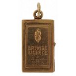 9ct gold opening driving licence charm, 2.3cm high, 3.7g : For further information on this lot