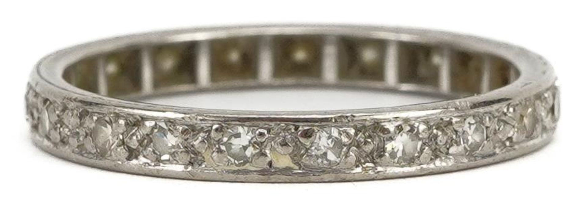 Unmarked white metal diamond eternity ring, size M/N, 2.2g : For further information on this lot