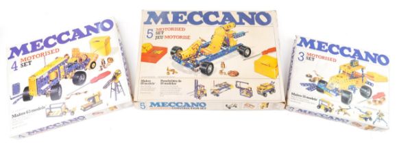 Three vintage Meccano motorised construction sets with boxes comprising numbers 3, 4 and 5 : For