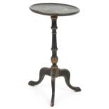 Regency style chinoiserie lacquered tripod side table hand painted with figures beside water, 55.5cm