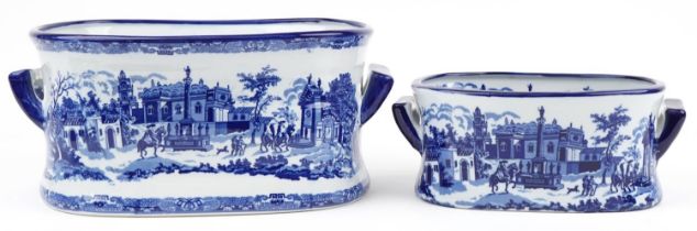 Graduated pair of blue and white porcelain planters with twin handles decorated with classical