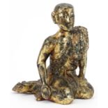 Thai gilt carved wood seated figure of a robed monk, 31cm high : For further information on this lot