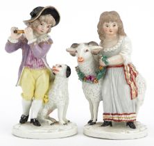 Pair of 19th century German porcelain figures of a young boy and girl with goat and dog, factory