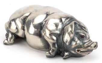 Silver recumbent pig with ruby eyes, impressed Russian marks to the base, 7cm in length, 44.0g : For