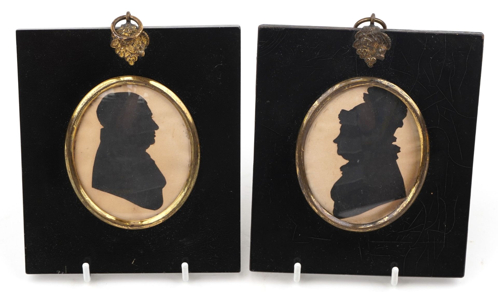 Pair of Georgian silhouette pictures in black painted frames, labels to the reverse, each 13cm x