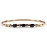 9ct gold sapphire and diamond bangle, 6.5cm wide, 4.7g : For further information on this lot