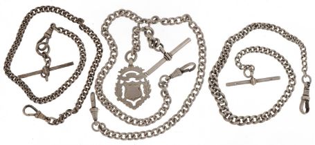 Three silver watch chains with T bars and dog clips, one with sports jewel, the largest 38cm in