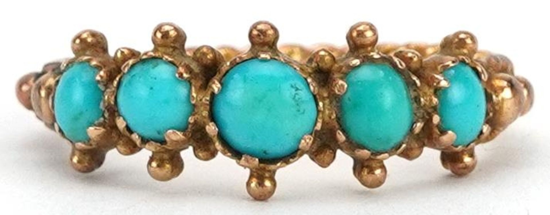 Antique unmarked gold cabochon turquoise five stone ring with ornate setting and rope twist design