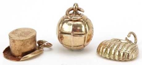 Three 9ct gold charms comprising top hat, football and handbag, the largest 1.3cm in length, total