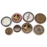 Four marine interest brass sextants and compasses, the largest 7.5cm in diameter : For further