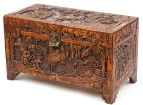 Good Chinese camphor wood trunk finely carved with cockerels amongst bamboo grove, peony blossom and