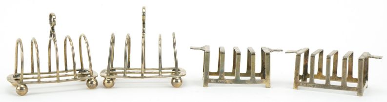 Two pairs of silver four slice toast racks including an Art Deco pair by Mappin & Webb, the