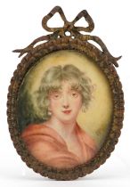 19th century oval hand painted portrait miniature of a young female housed in an ornate brass