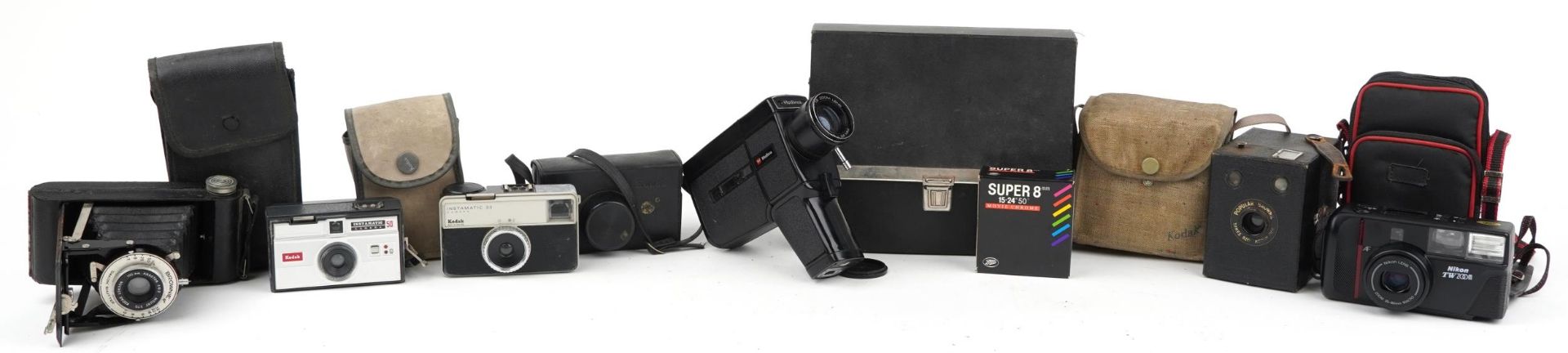 Six vintage cameras with cases including Super 8 movie camera, Kodak Brownie and Kodak