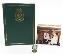 British military Elizabeth II South Atlantic medal with related book and photograph, the medal