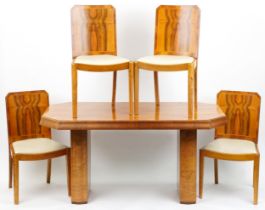 Art Deco walnut twin pedestal dining table and four chairs with cream leatherette upholstered seats,