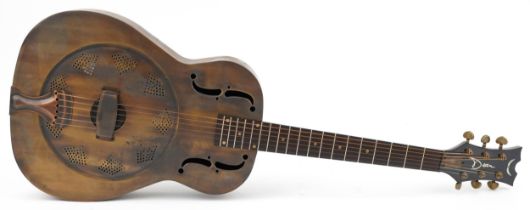 Dean Resonator acoustic brass guitar with mother of pearl inlay housed in a Kinsman protective