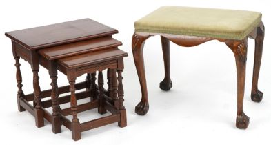 Victorian style piano stool on claw and ball feet and a nest of three oak occasional tables, the