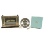 Oak framed silver desk calendar with a circular silver dish, two silver thimbles and a silver ingot,