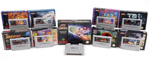 Nine Super Nintendo games with boxes including Starwing, Super Air Dive, Desert Fighter, Jurassic