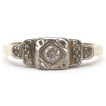 Art Deco 18ct gold diamond ring with stepped shoulders, the central diamond approximately 0.11