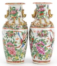 Pair of Chinese Canton porcelain vases decorated in relief with dragons, each hand painted in the