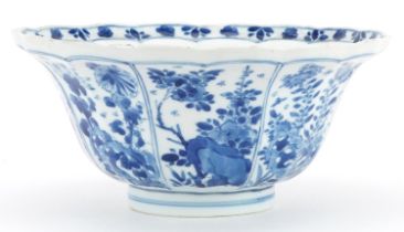 Chinese blue and white porcelain bowl hand painted with panels of flowers, six figure character