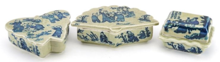 Three Chinese porcelain boxes and covers decorated with figures and erotic scenes, the largest 14.