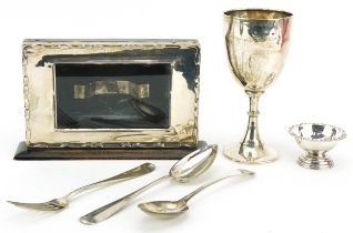 Georgian and later silver including desk calendar frame, trophy and tablespoons, the largest 21cm