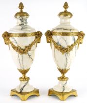Pair of French calacatta marble and ormolu urn design garnitures with ram's head mounts, 45cm high :