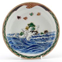 Japanese porcelain bowl hand painted with birds above crashing waves, character marks to the