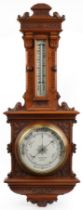 Victorian aesthetic walnut aneroid wall barometer with thermometer carved with foliage, retailed